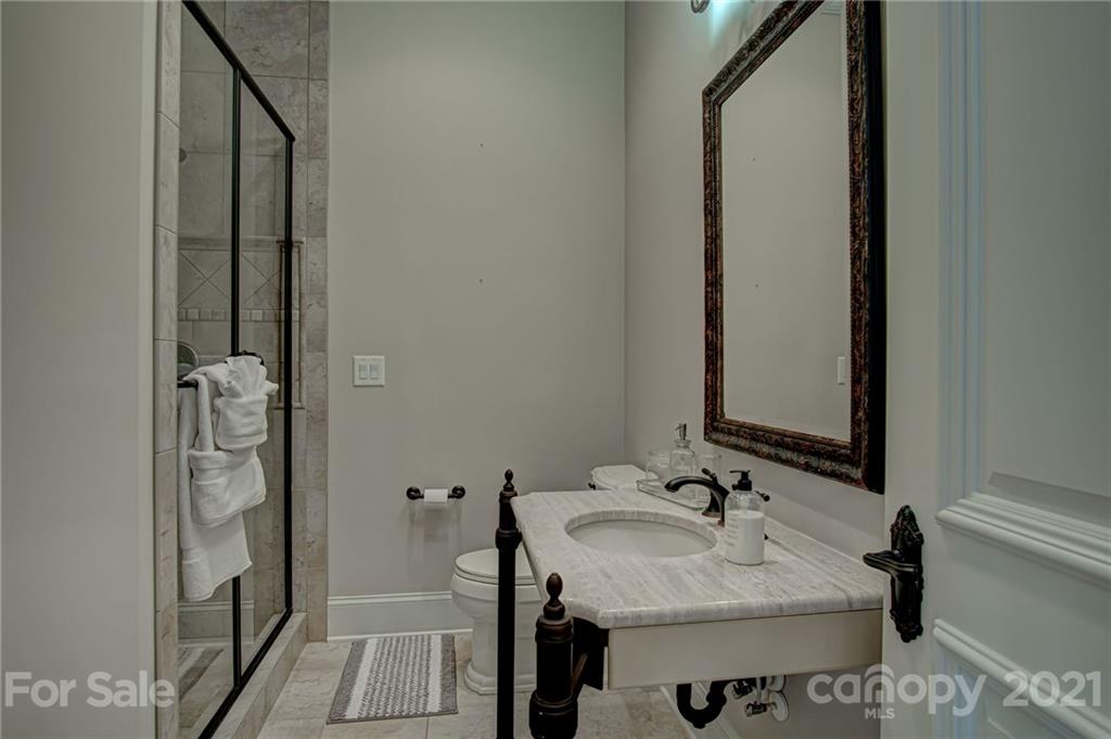 2105 South Wendover Road Charlotte, NC 28211 - Photo 27 of 46 a bathroom with a sink and a mirror