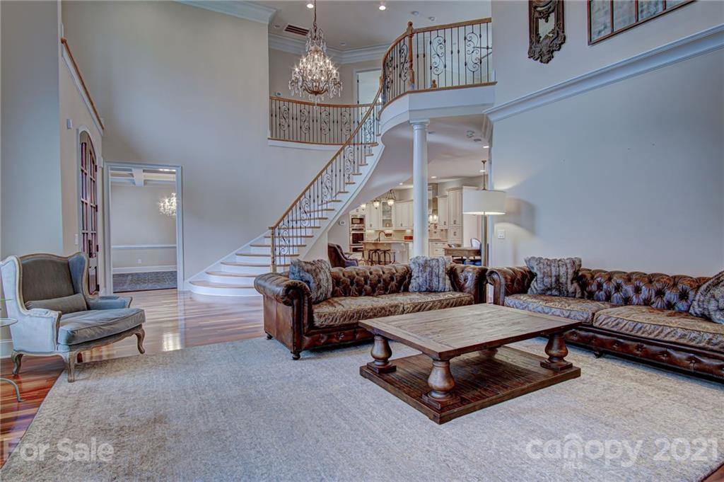 2105 South Wendover Road Charlotte, NC 28211 - Photo 4 of 46 a living room with furniture and stairs