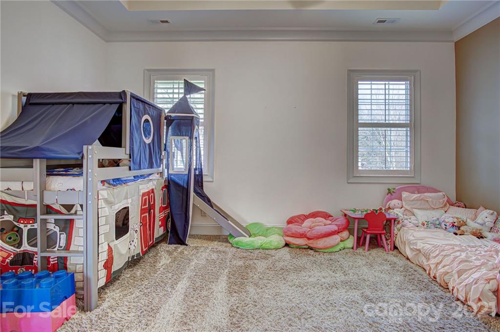 2105 South Wendover Road Charlotte, NC 28211 - Photo 35 of 46 a bedroom with a bed and a window