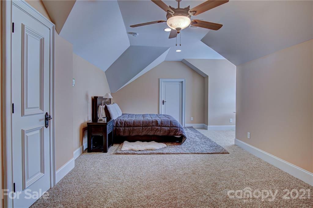 2105 South Wendover Road Charlotte, NC 28211 - Photo 36 of 46 a living room with furniture and a ceiling fan