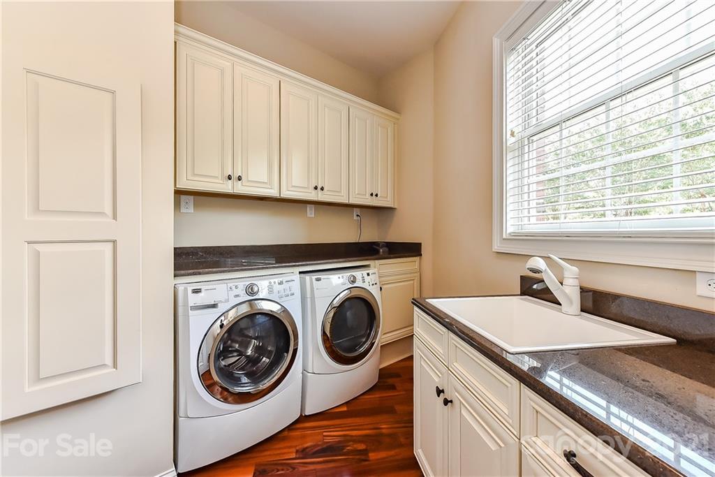 2105 South Wendover Road Charlotte, NC 28211 - Photo 38 of 46 a utility room with sink dryer and washer