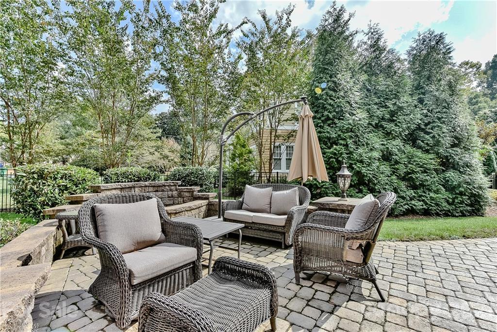 2105 South Wendover Road Charlotte, NC 28211 - Photo 40 of 46 a roof deck with couches and wooden fence