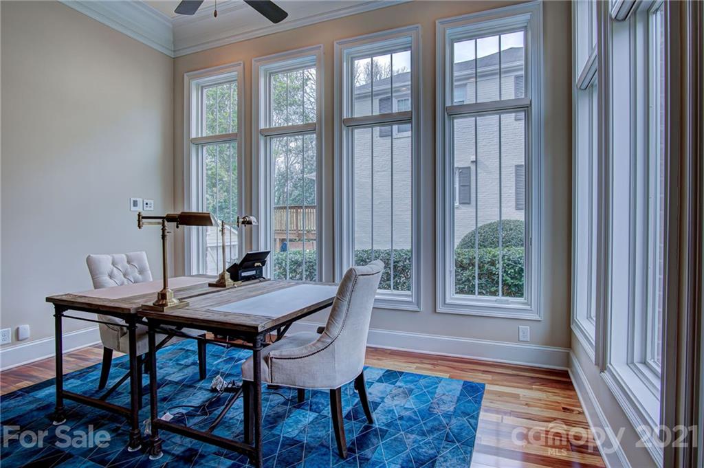 2105 South Wendover Road Charlotte, NC 28211 - Photo 9 of 46 a view of a dining room with furniture window and wooden floor