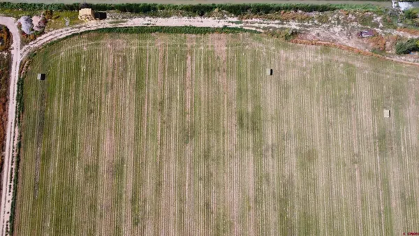 a view of a swimming pool with furniture