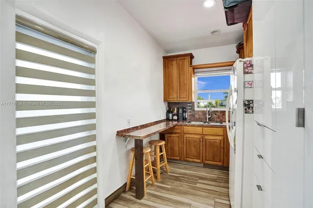 a view of a kitchen and a sink