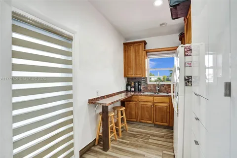 a view of a kitchen and a sink