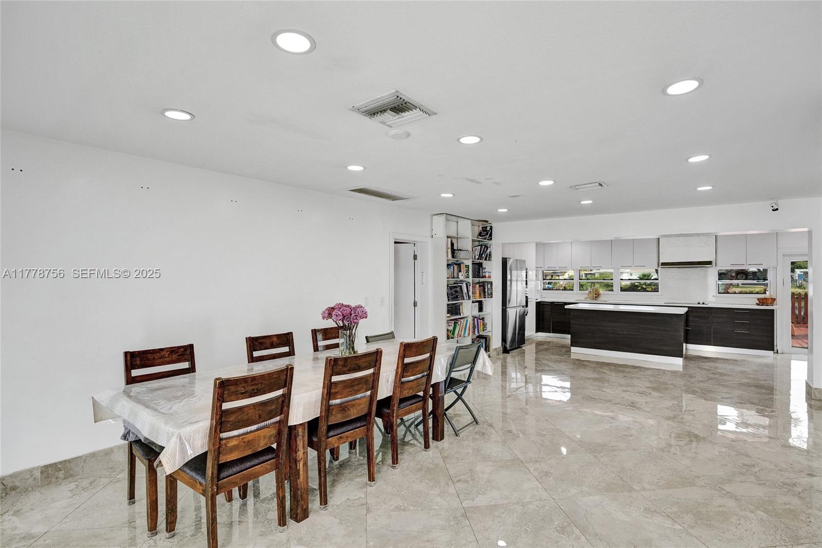 4185 Southwest 49th Court Dania Beach, FL 33314 - Photo 7 of 21 a kitchen with a table and chairs