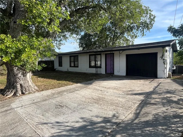 a house with trees in front of it
