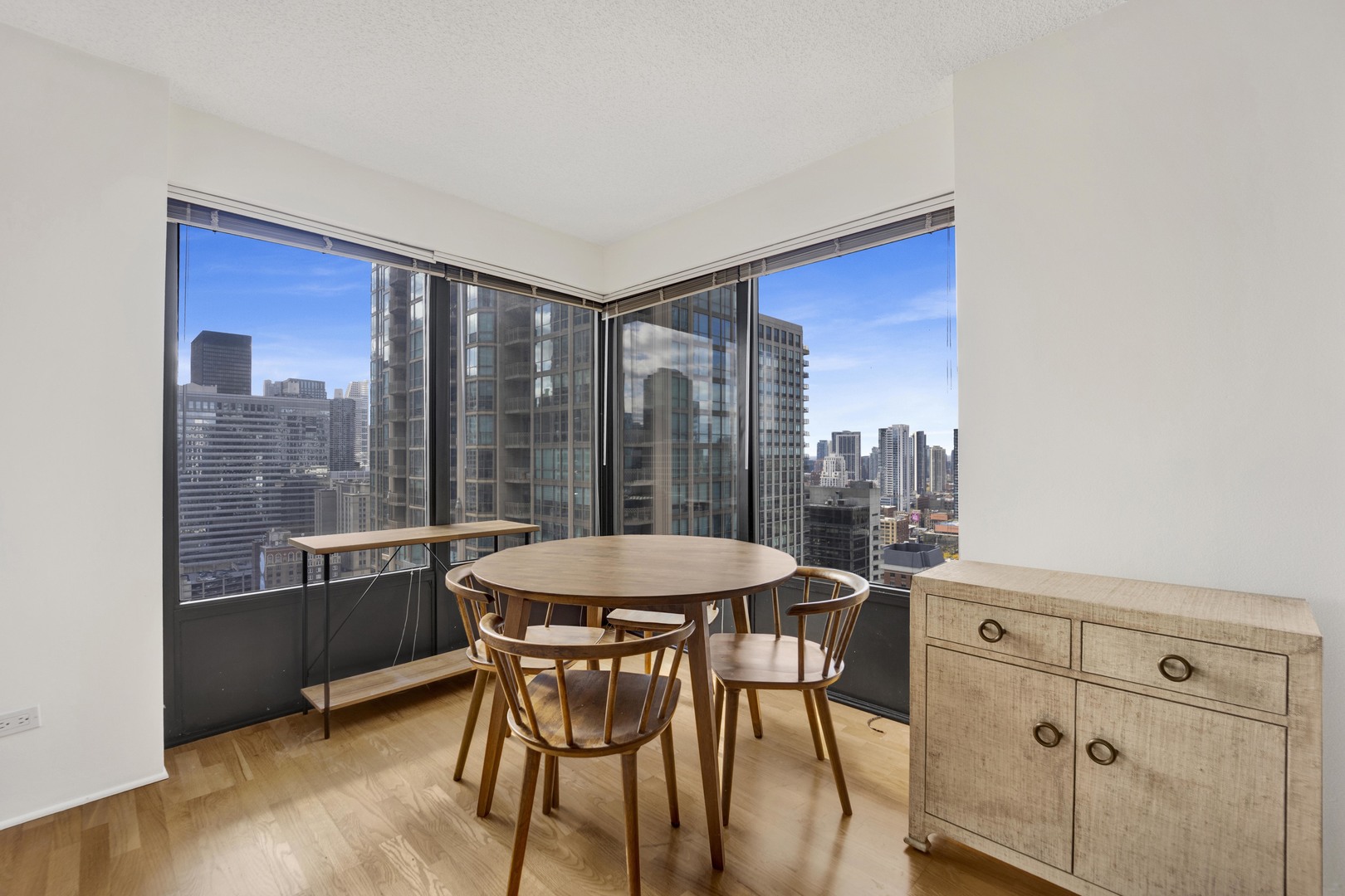 30 East Huron Street, Unit 3204 Chicago, IL 60611 - Photo 11 of 17 a dining room with furniture and window