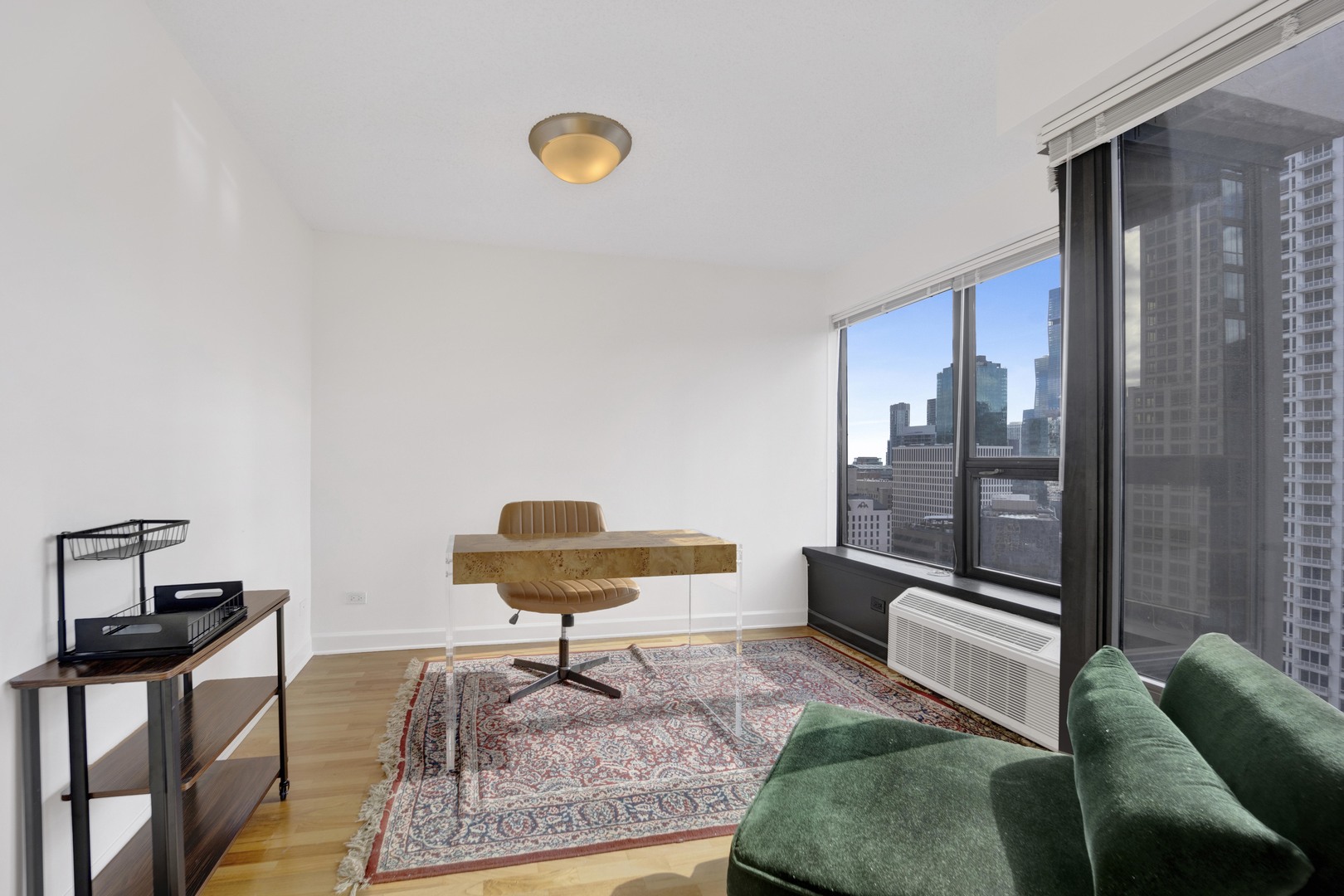 30 East Huron Street, Unit 3204 Chicago, IL 60611 - Photo 15 of 17 a living room with a couch and a coffee table
