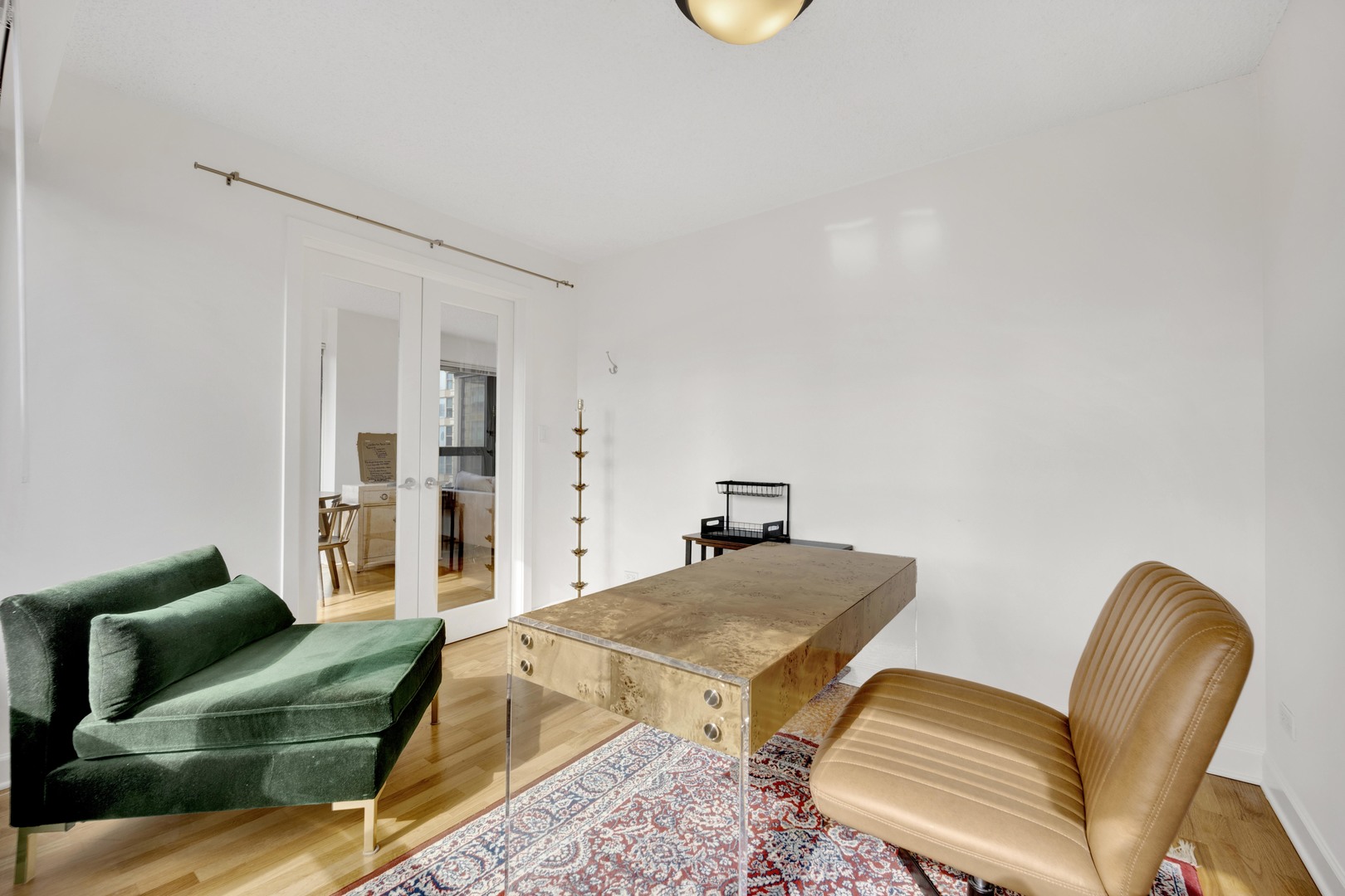 30 East Huron Street, Unit 3204 Chicago, IL 60611 - Photo 16 of 17 a bedroom with furniture and a couch