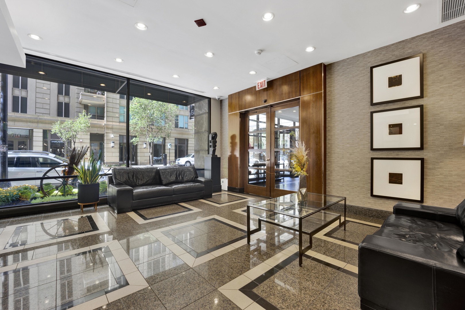 30 East Huron Street, Unit 3204 Chicago, IL 60611 - Photo 2 of 17 a living room with furniture and a flat screen tv