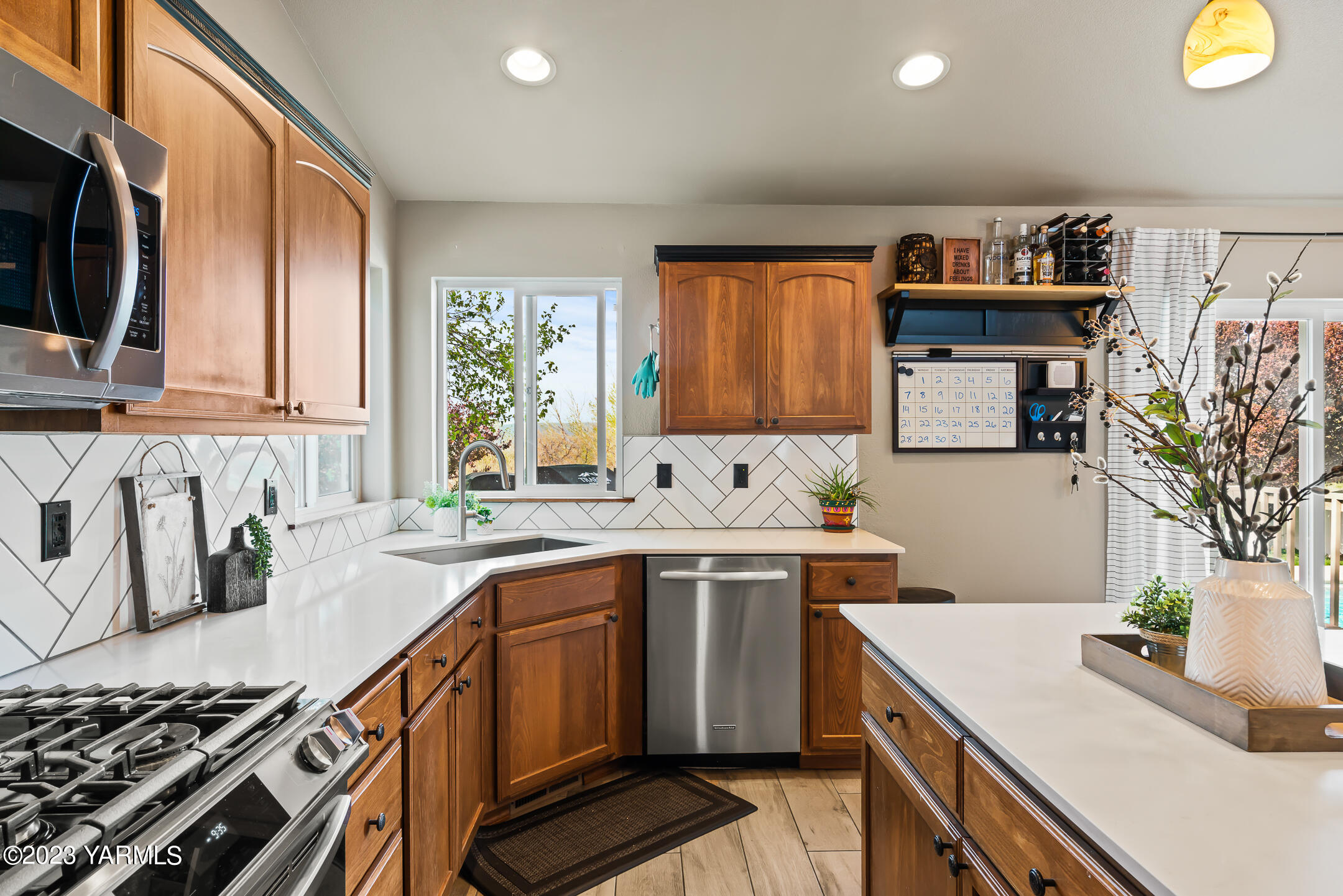 4702 Goat Rocks Court Yakima, WA 98901 - Photo 11 of 36 a kitchen with a sink stove and cabinets