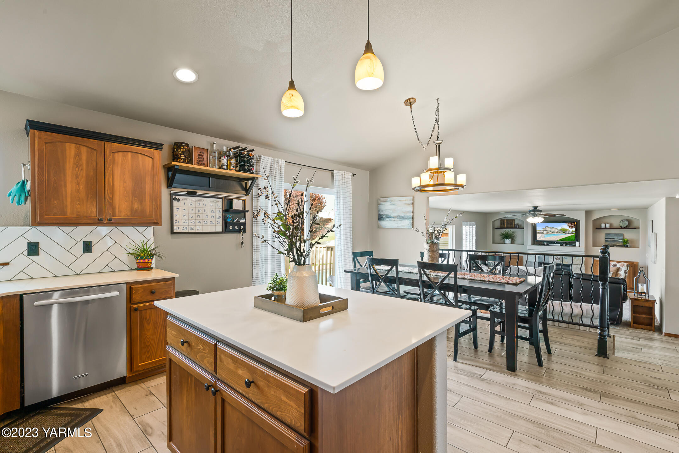4702 Goat Rocks Court Yakima, WA 98901 - Photo 12 of 36 a kitchen with a table chairs and wooden floor
