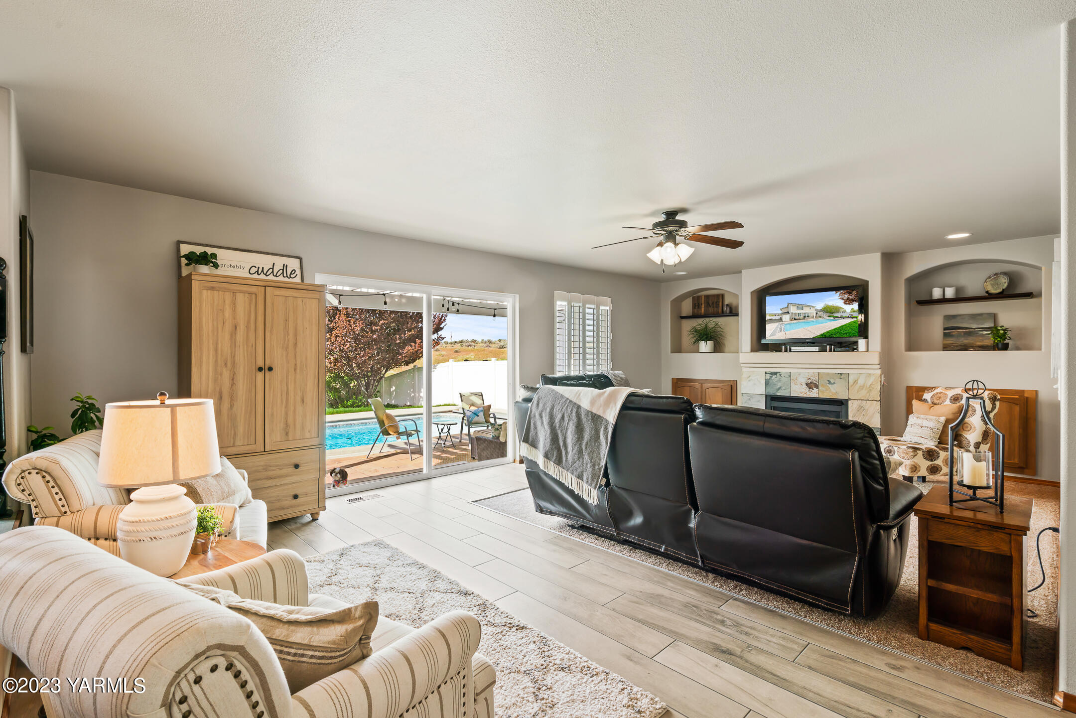 4702 Goat Rocks Court Yakima, WA 98901 - Photo 15 of 36 a living room with furniture and a flat screen tv