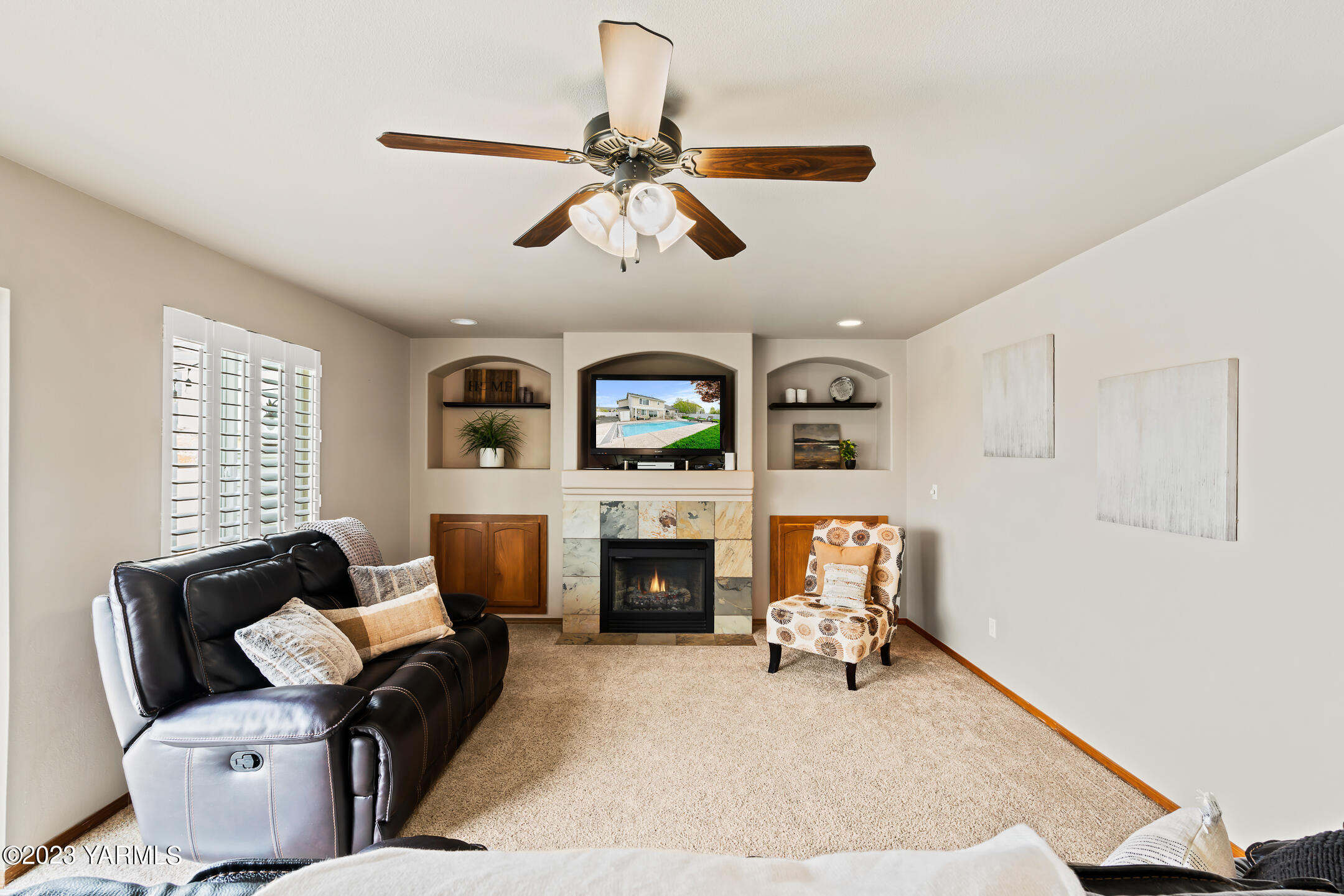 4702 Goat Rocks Court Yakima, WA 98901 - Photo 16 of 36 a living room with furniture and a fireplace