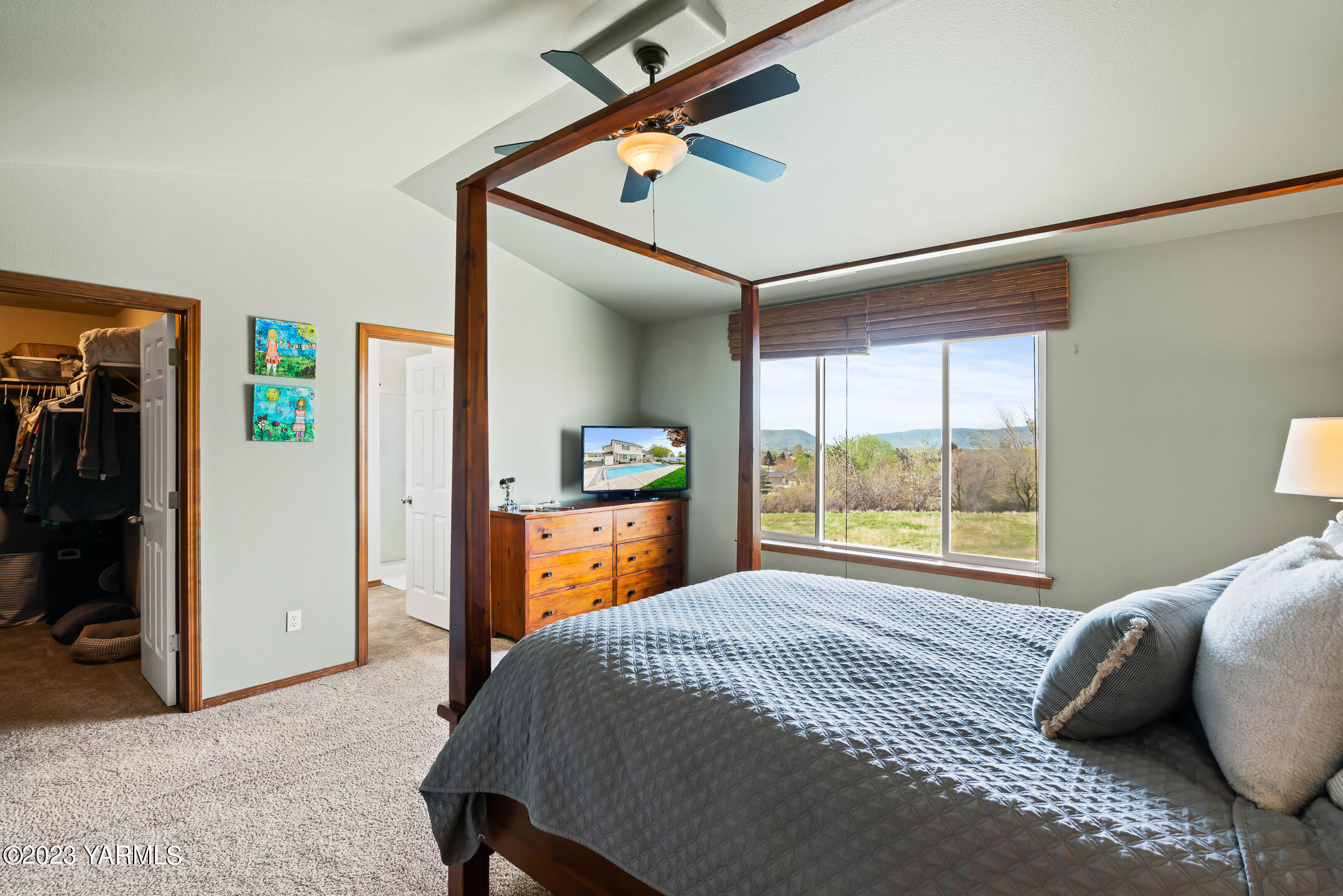 4702 Goat Rocks Court Yakima, WA 98901 - Photo 22 of 36 a bed sitting in a bedroom next to a window