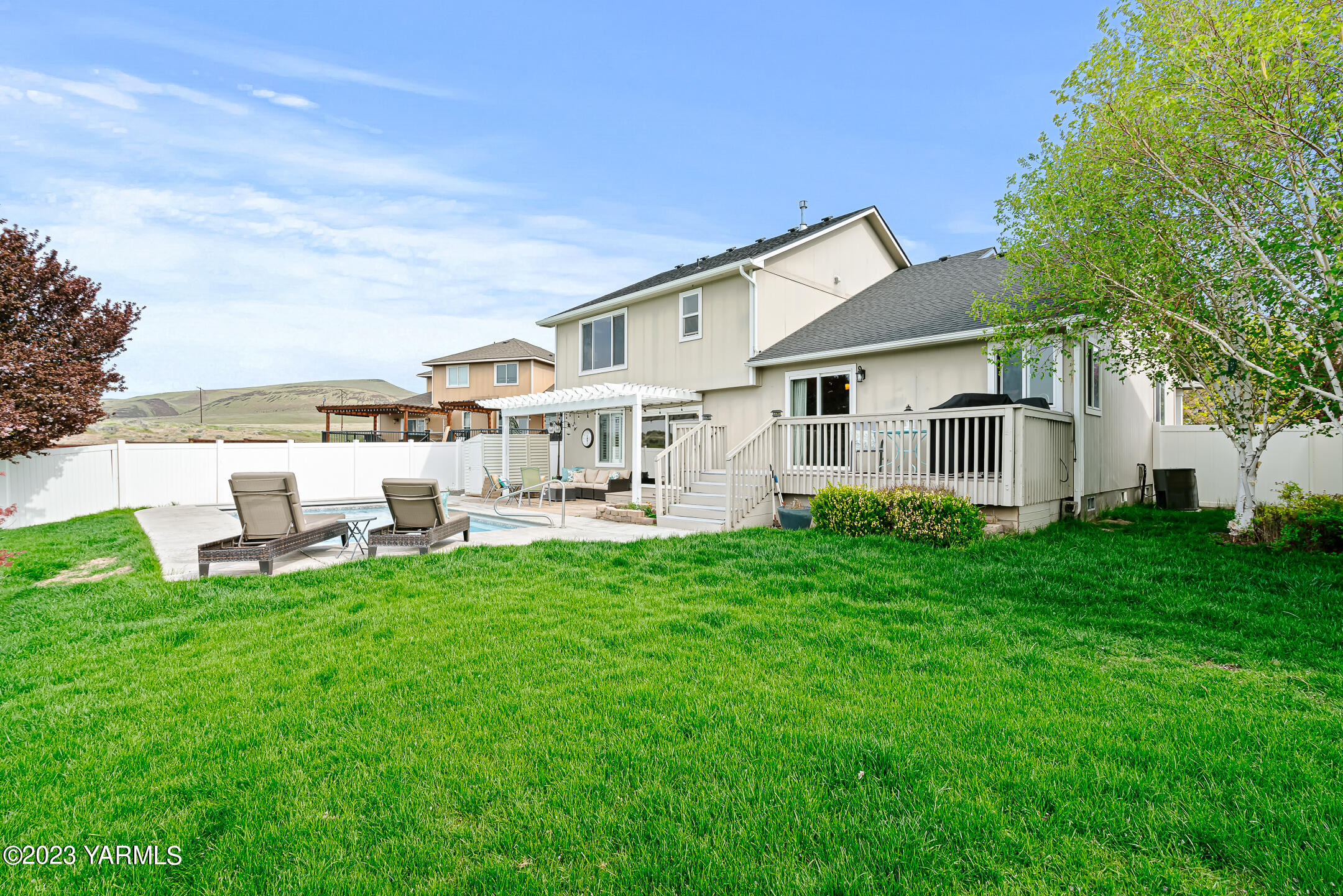 4702 Goat Rocks Court Yakima, WA 98901 - Photo 33 of 36 a view of a house with backyard porch and garden