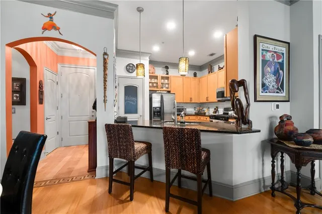 a dining room with furniture a chandelier and window