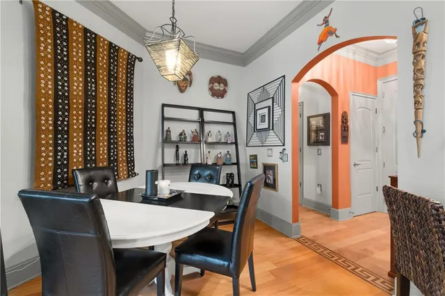 a living room with fireplace furniture and a large window