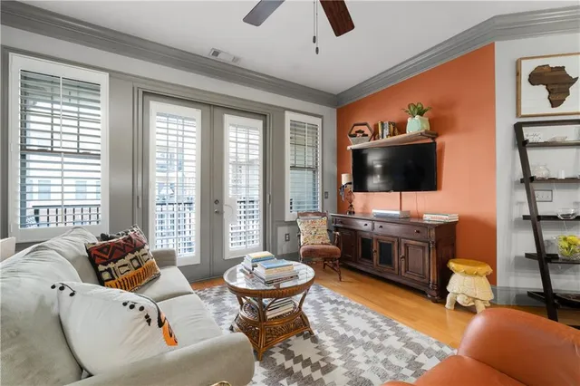 a living room with furniture and a flat screen tv