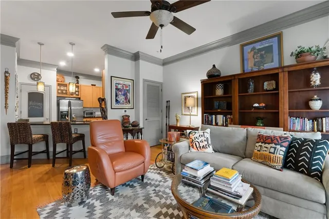 a living room with fireplace furniture and a flat screen tv