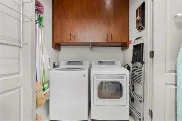 a bathroom with a sink mirror and a toilet