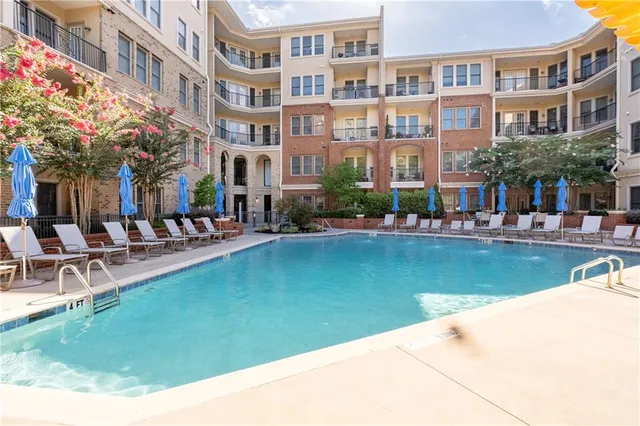 a aerial view of a building with swimming pool