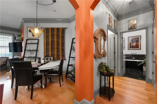 a view of a dining room with furniture and chandelier