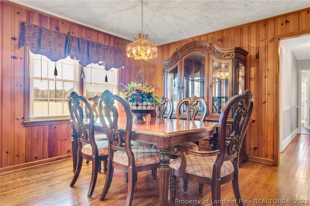 5457 Sambo Jackson Road Godwin, NC 28344 - Photo 14 of 33 a view of a dining room with furniture window and wooden floor