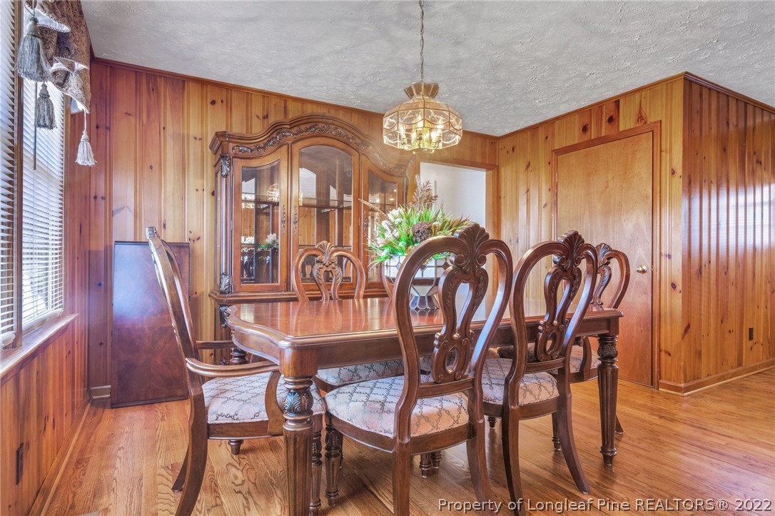 5457 Sambo Jackson Road Godwin, NC 28344 - Photo 15 of 33 a view of a dining room with furniture window and wooden floor