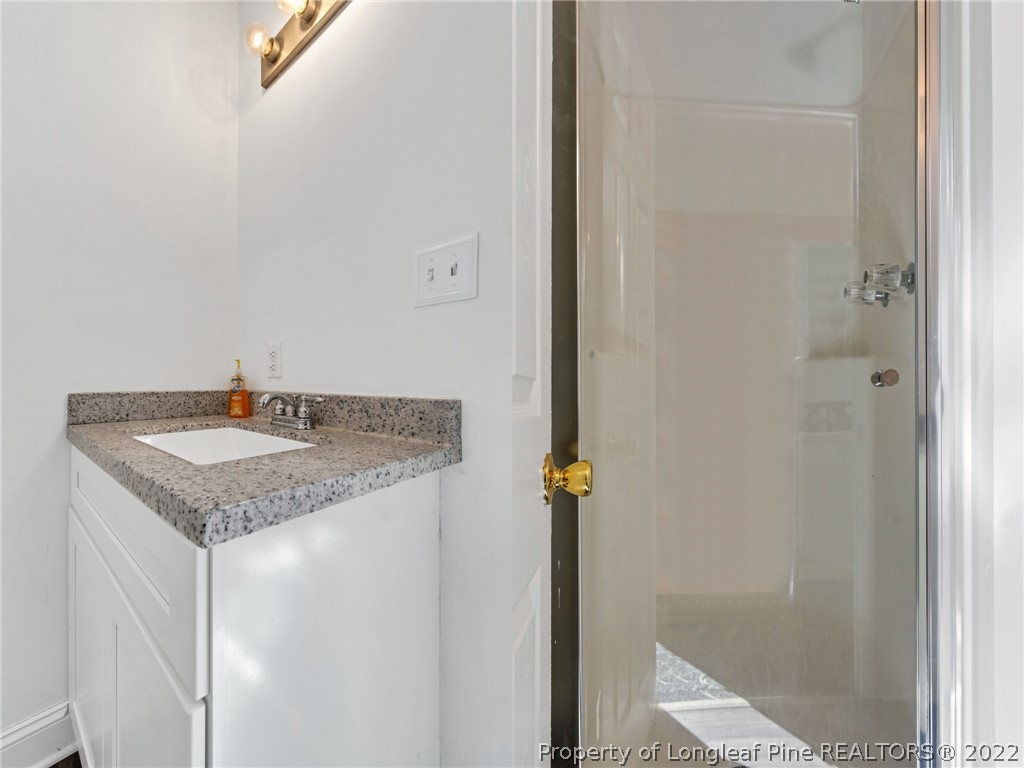 5457 Sambo Jackson Road Godwin, NC 28344 - Photo 24 of 33 a sink and a mirror