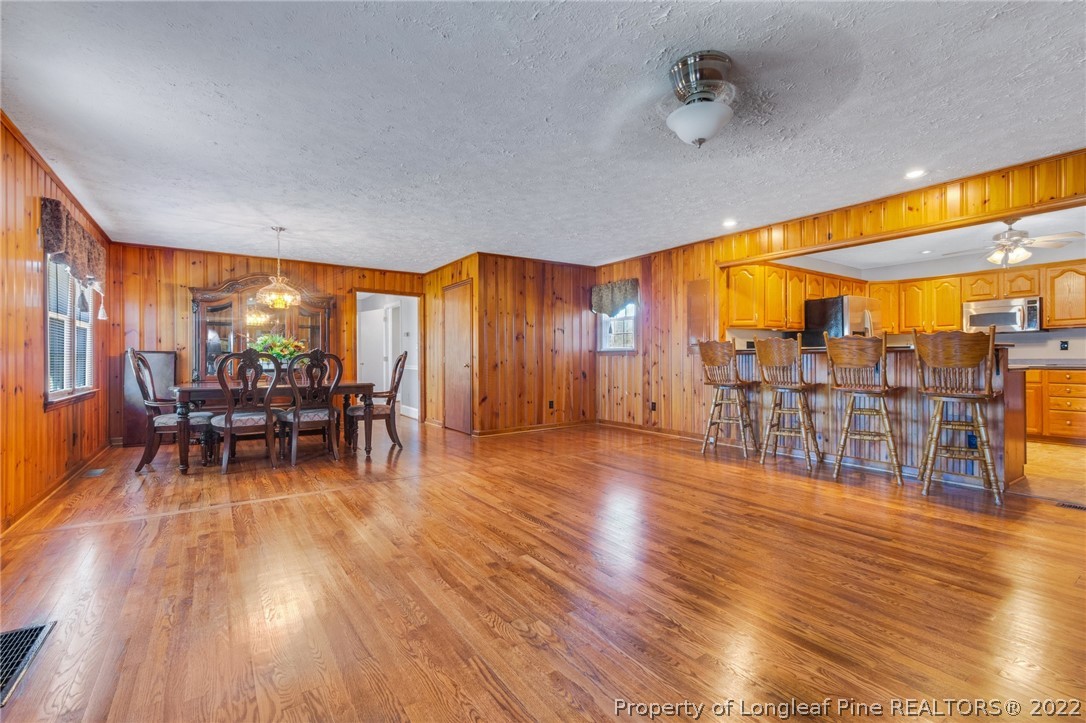 5457 Sambo Jackson Road Godwin, NC 28344 - Photo 4 of 33 a view of a dining room with furniture and wooden floor