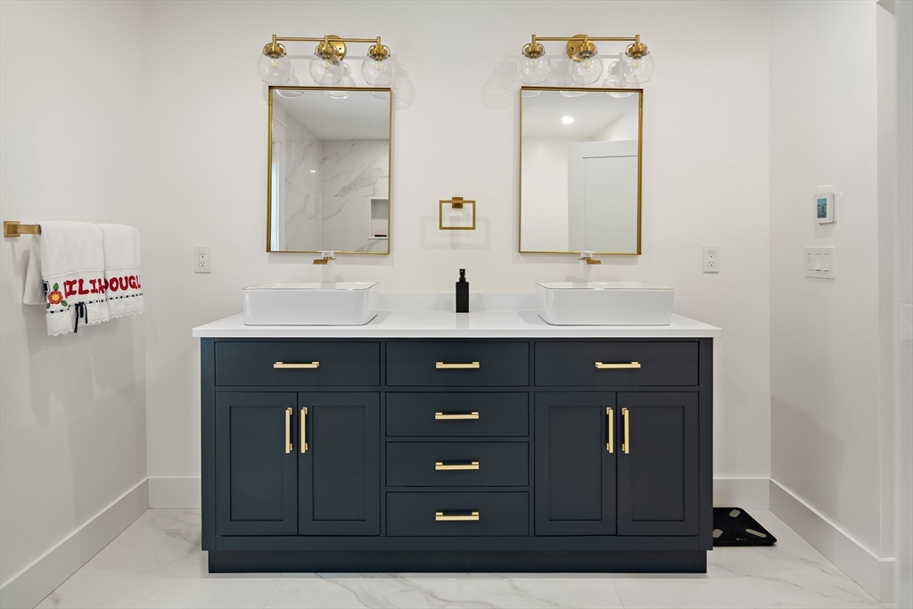 355 Maynard Road Sudbury, MA 01776 - Photo 12 of 18 a bathroom with a sink vanity and mirror