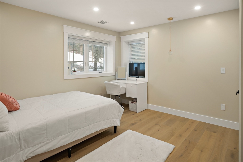 355 Maynard Road Sudbury, MA 01776 - Photo 15 of 18 a bedroom with a bed and a window