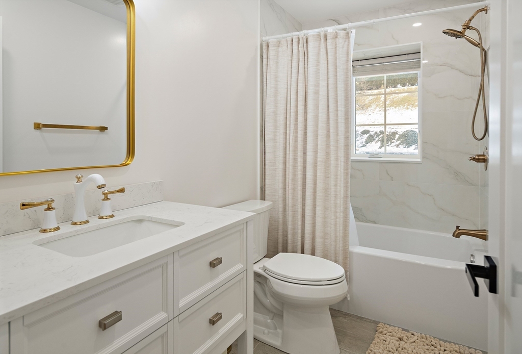 355 Maynard Road Sudbury, MA 01776 - Photo 16 of 18 a bathroom with a sink a toilet and shower