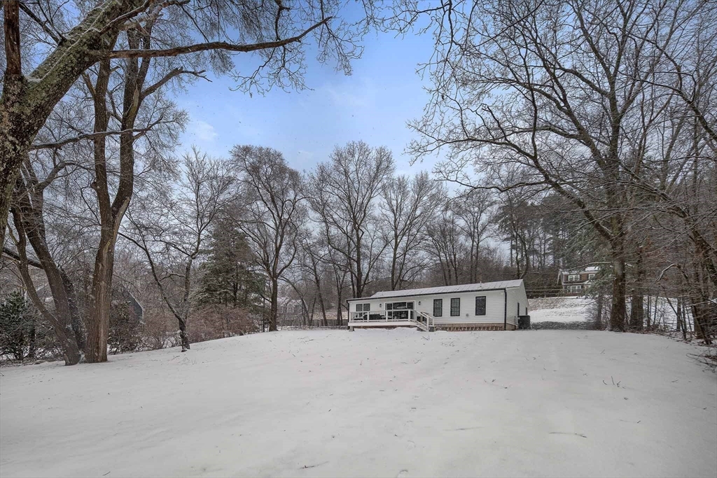 355 Maynard Road Sudbury, MA 01776 - Photo 18 of 18 a front view of a house with large trees