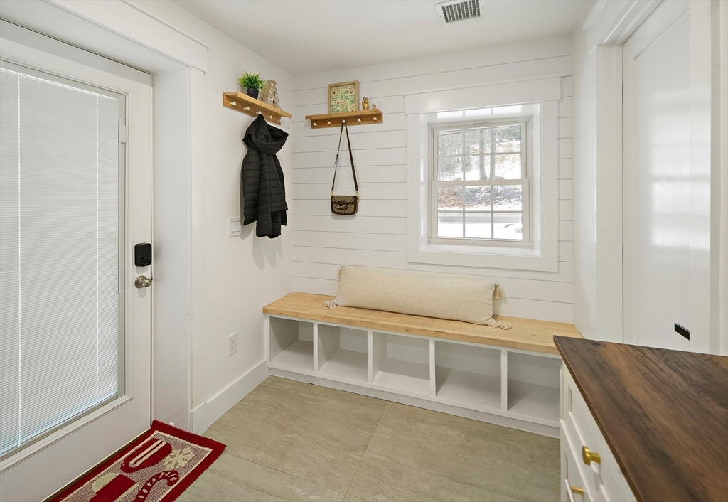 355 Maynard Road Sudbury, MA 01776 - Photo 2 of 18 a bedroom with a bed and a window