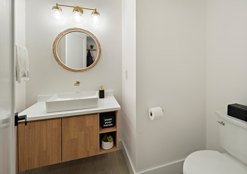 355 Maynard Road Sudbury, MA 01776 - Photo 3 of 18 a bathroom with a sink and a mirror
