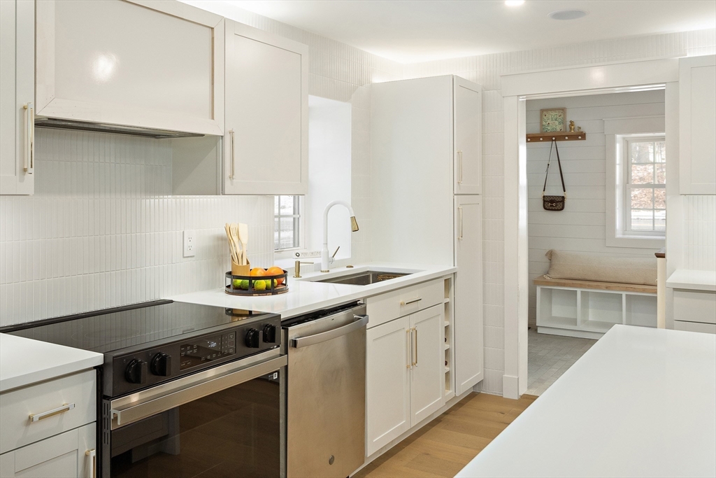 355 Maynard Road Sudbury, MA 01776 - Photo 5 of 18 a kitchen with a stove and a sink