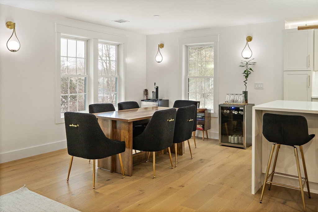 355 Maynard Road Sudbury, MA 01776 - Photo 6 of 18 a view of a dining room with furniture window and wooden floor