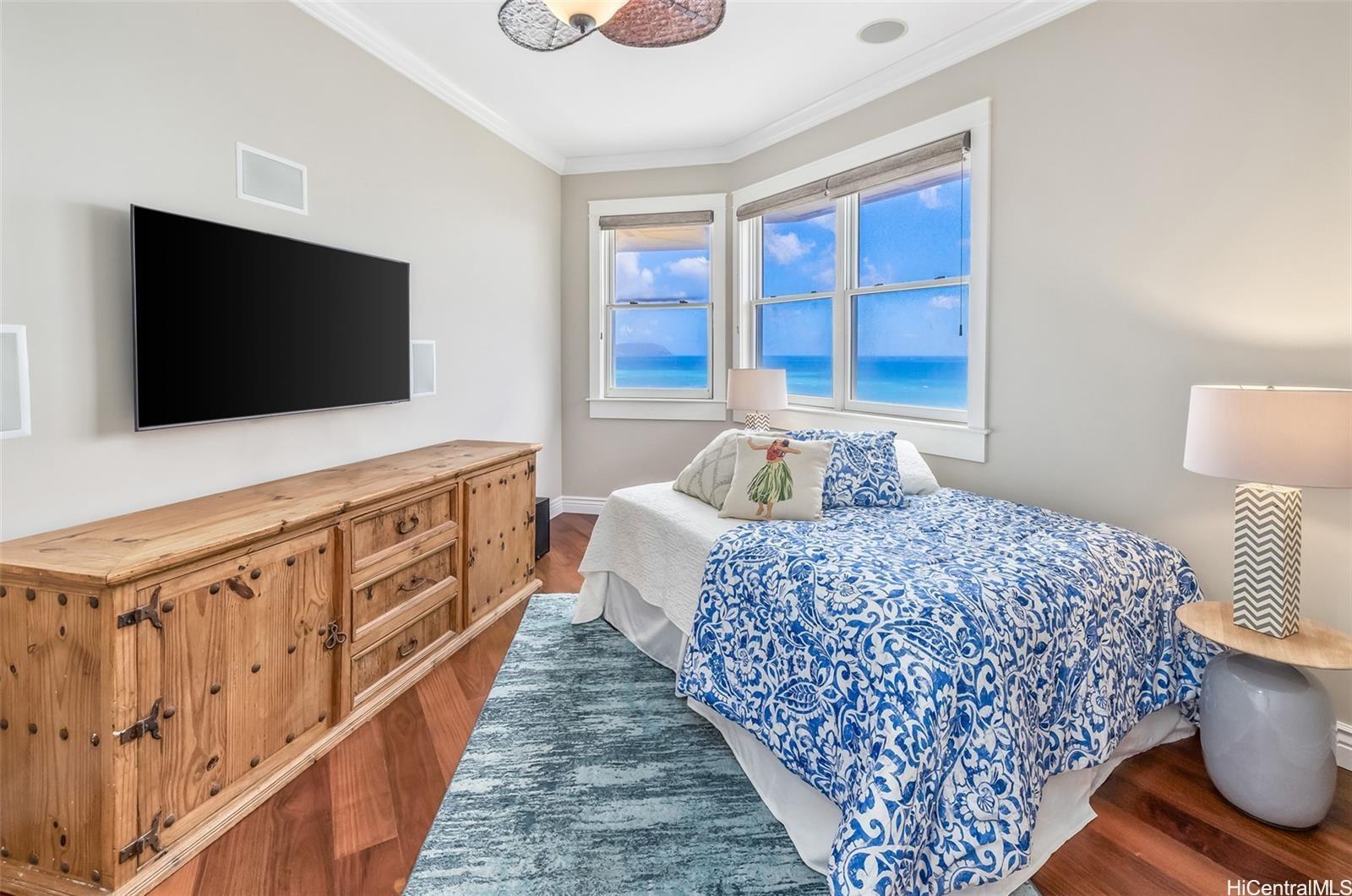 4125 Black Point Road Honolulu, HI 96816 - Photo 20 of 25 a bedroom with bed and flat screen tv