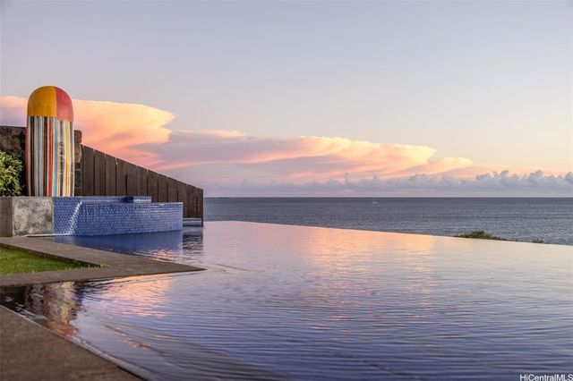 a view of a dining table and chairs in the patio
