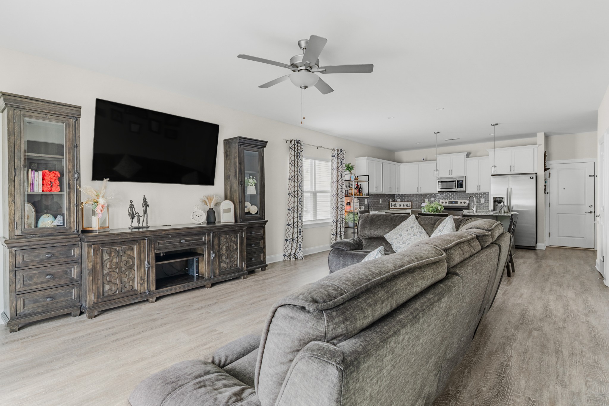 404 Golf Club Lane Springfield, TN 37172 - Photo 13 of 38 a living room with furniture and a flat screen tv
