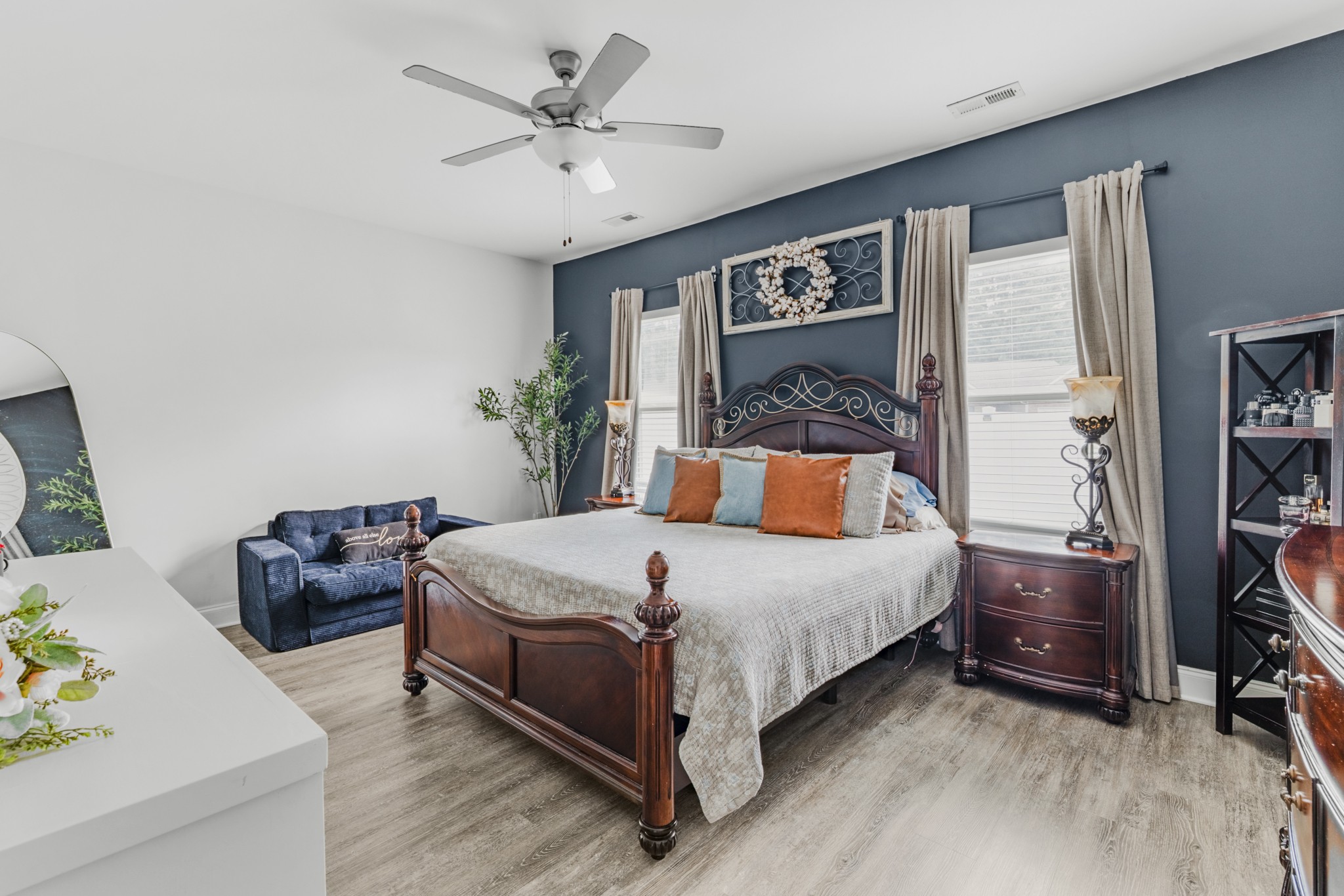 404 Golf Club Lane Springfield, TN 37172 - Photo 15 of 38 a bedroom with a bed and a chandelier