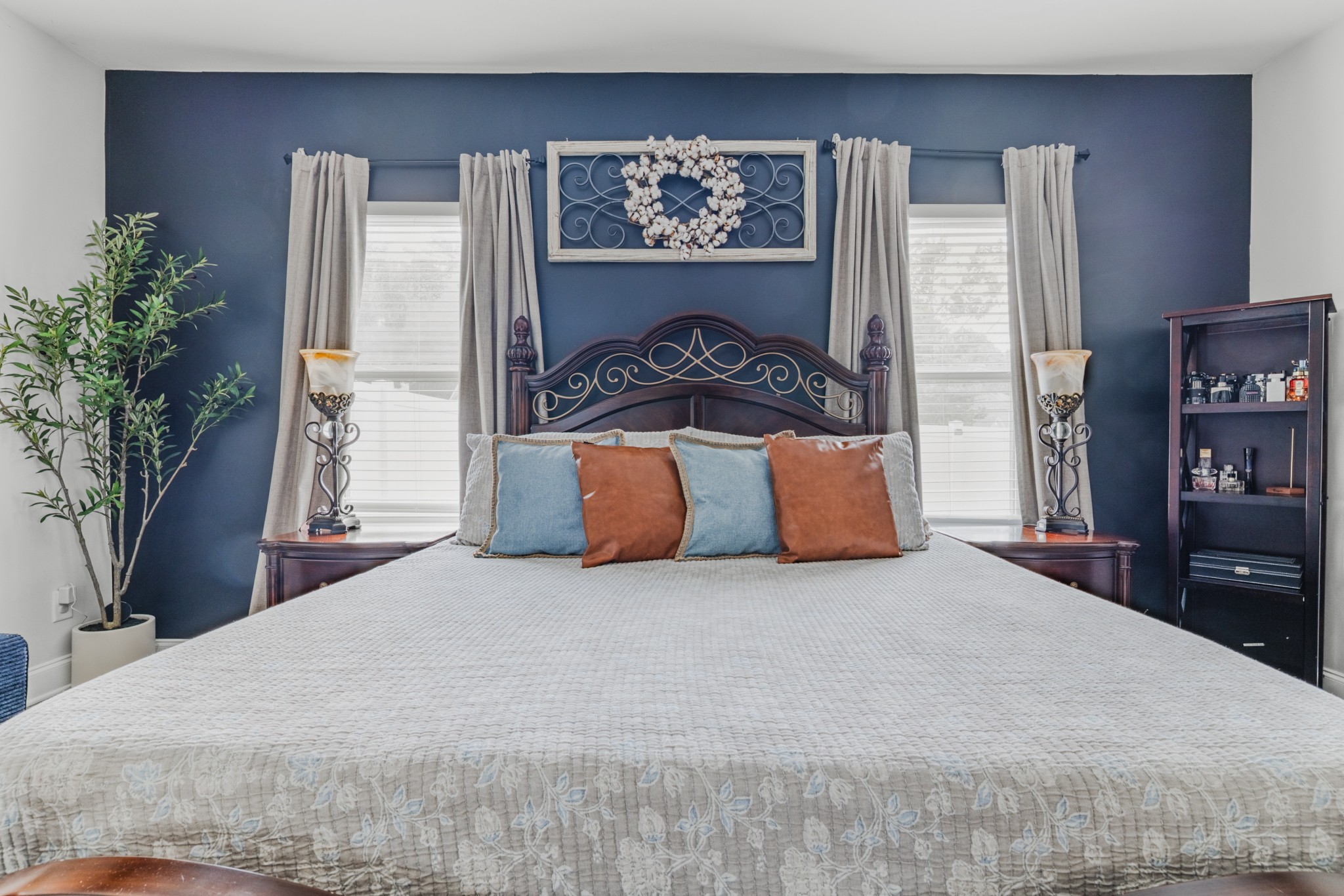 404 Golf Club Lane Springfield, TN 37172 - Photo 16 of 38 a bedroom with a large bed and a potted plant