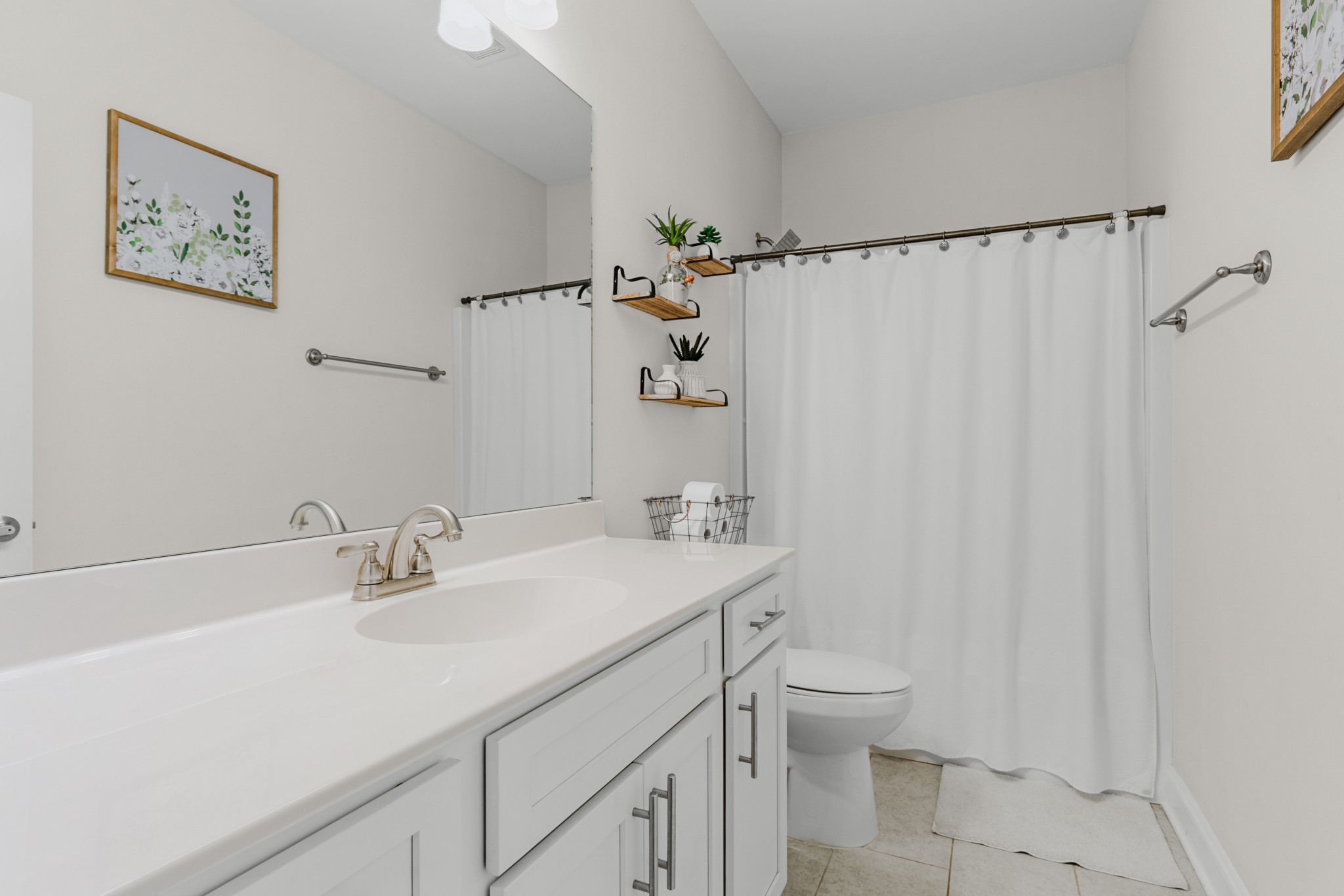 404 Golf Club Lane Springfield, TN 37172 - Photo 26 of 38 a bathroom with a sink a toilet and shower curtain