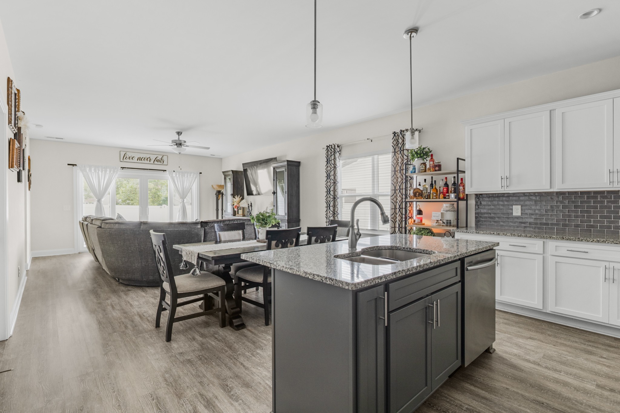 404 Golf Club Lane Springfield, TN 37172 - Photo 7 of 38 a kitchen with sink cabinets and dining table