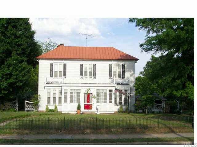 314 South Main Street Roxboro, NC 27573 - Photo 1 of 1 a front view of a house with a garden