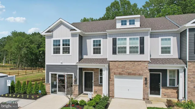a aerial view of a house with a yard